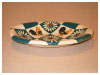 A Bali stoneware cockerel and daisy oval dish, decorated with cockerels and daisies in diamond shapes - third view.